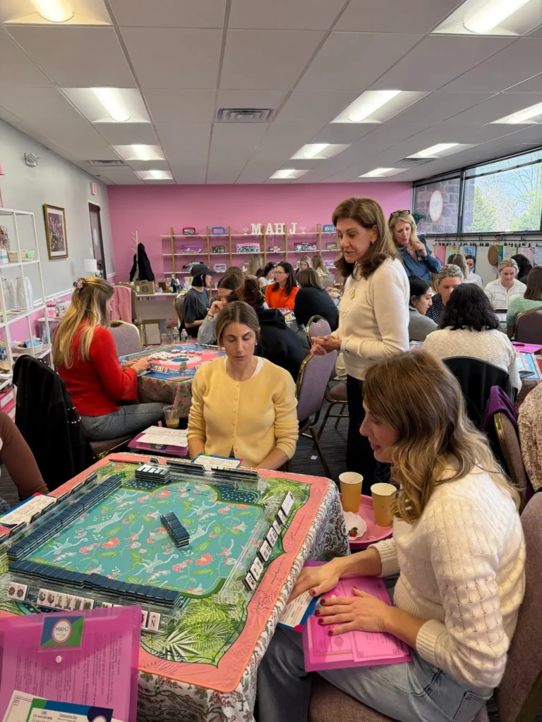 A woman teaching a mahjong class