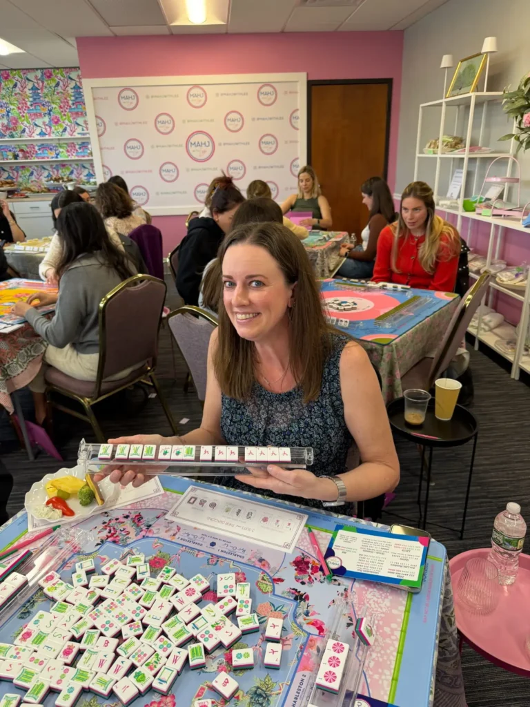 Woman showing off her mahjong tiles